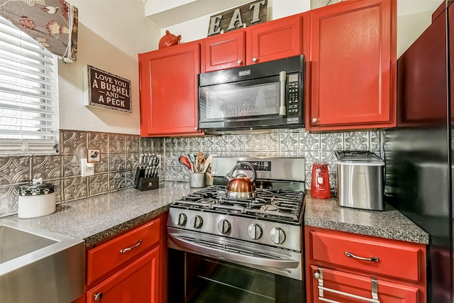 307 Squall Ct, Crosby, TX 77532 - kitchen with black appliances, tasteful backsplash, a sink, and dark brown cabinets