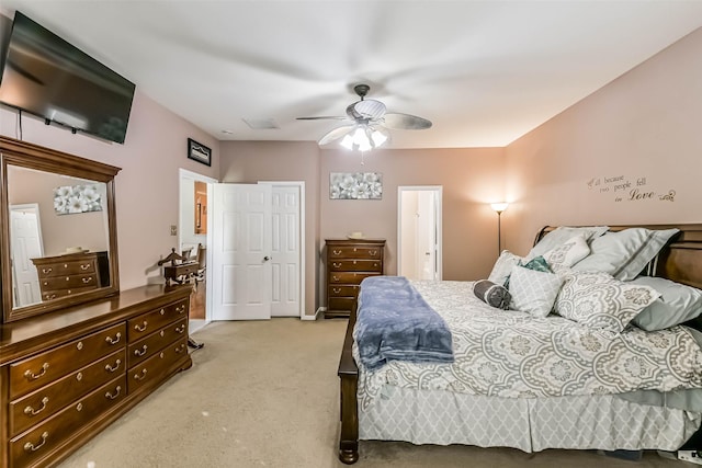 307 Squall Ct, Crosby, TX 77532 - bedroom featuring light colored carpet and ceiling fan