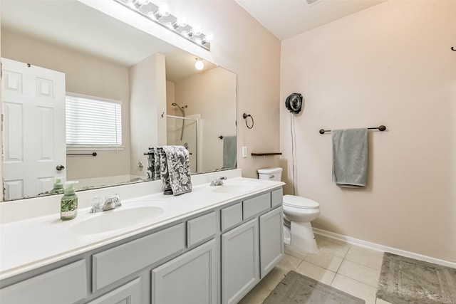 307 Squall Ct, Crosby, TX 77532 - full bathroom with toilet, a shower stall, double vanity, tile patterned floors, and baseboards