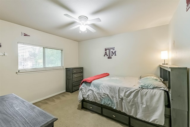 307 Squall Ct, Crosby, TX 77532 - bedroom with light colored carpet, baseboards, and ceiling fan