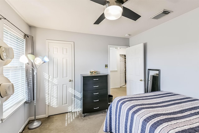 307 Squall Ct, Crosby, TX 77532 - bedroom featuring light colored carpet, baseboards, and ceiling fan
