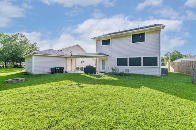 307 Squall Ct, Crosby, TX 77532 - back of house with a patio area, an outdoor fire pit, and central AC unit