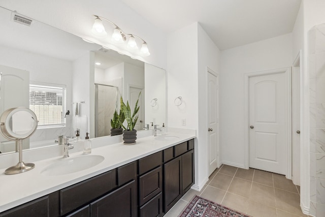 204 Catalina Cove Dr, Katy, TX 77493 - bathroom featuring a shower stall, tile patterned floors, and double vanity