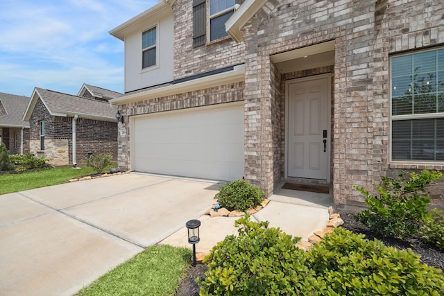 204 Catalina Cove Dr, Katy, TX 77493 - view of front facade with a garage, brick siding, and driveway