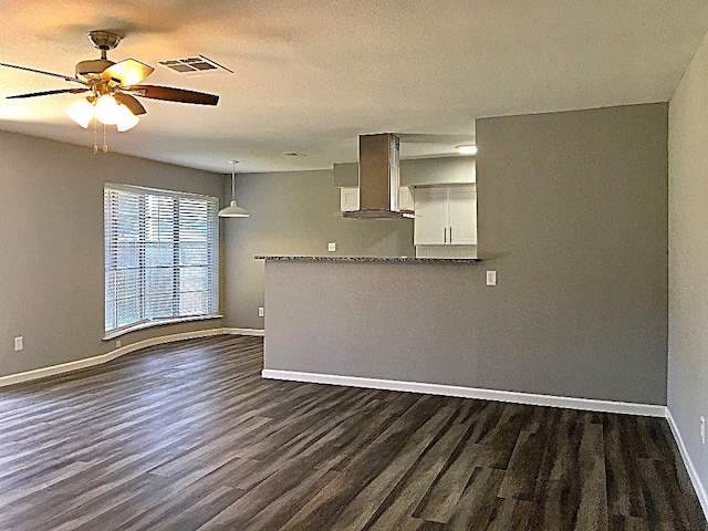 8322 Cabot St, Houston, TX 77078 - kitchen featuring ventilation hood, dark wood-style flooring, baseboards, and ceiling fan