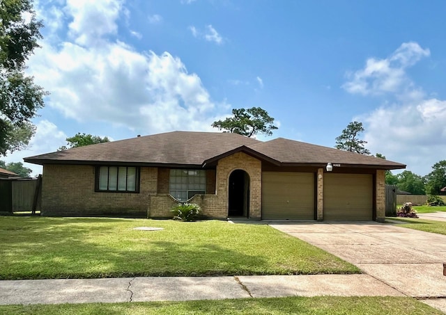 8322 Cabot St, Houston, TX 77078 - single story home featuring an attached garage, brick siding, and driveway