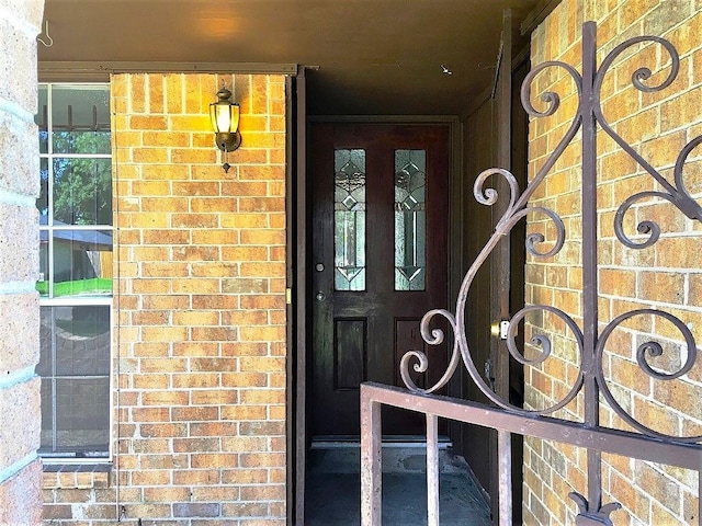 8322 Cabot St, Houston, TX 77078 - view of exterior entry featuring brick siding