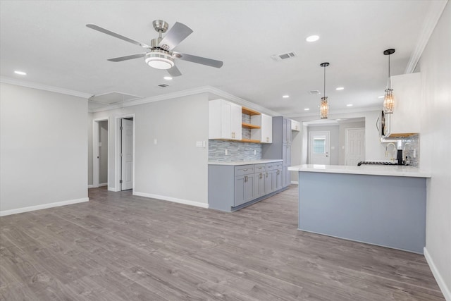 3518 Ball, Galveston, TX 77550 - kitchen featuring ornamental molding, a ceiling fan, gray cabinetry, backsplash, and recessed lighting