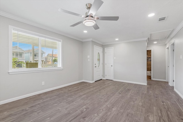 3518 Ball, Galveston, TX 77550 - spare room with attic access, crown molding, baseboards, ceiling fan, and wood finished floors