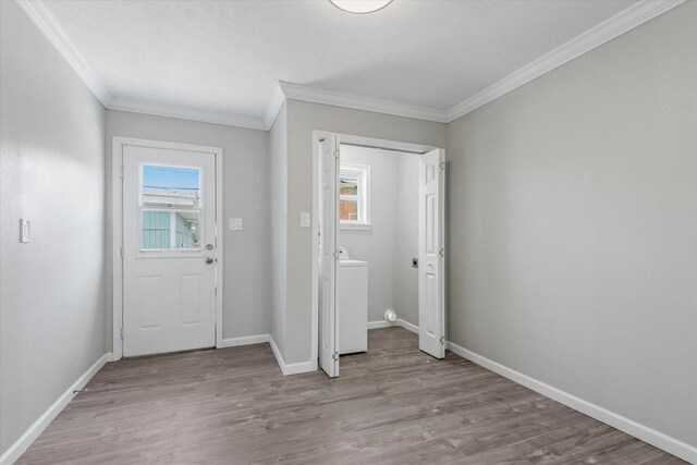 3518 Ball, Galveston, TX 77550 - foyer entrance featuring crown molding, wood finished floors, and baseboards