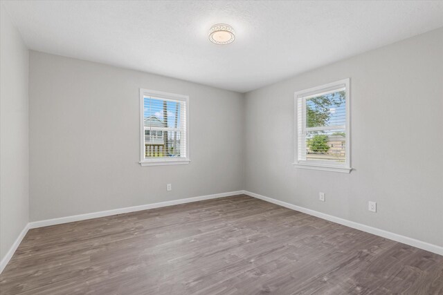 3518 Ball, Galveston, TX 77550 - empty room featuring wood finished floors and baseboards