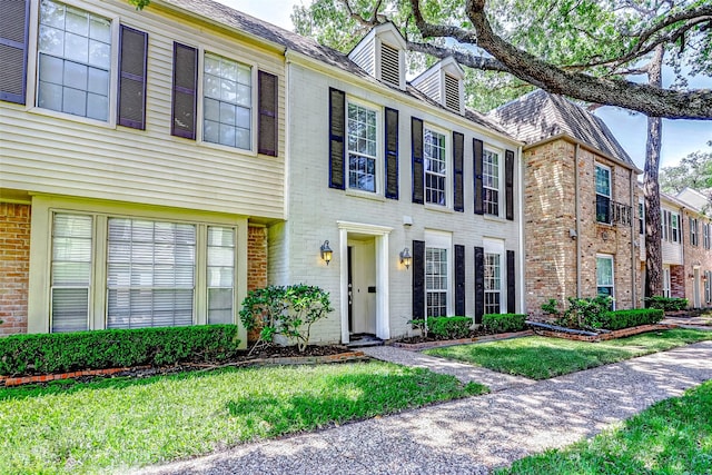 13060 Trail Hollow Dr Unit 3060, Houston, TX 77079 - view of front of house featuring brick siding and a front yard