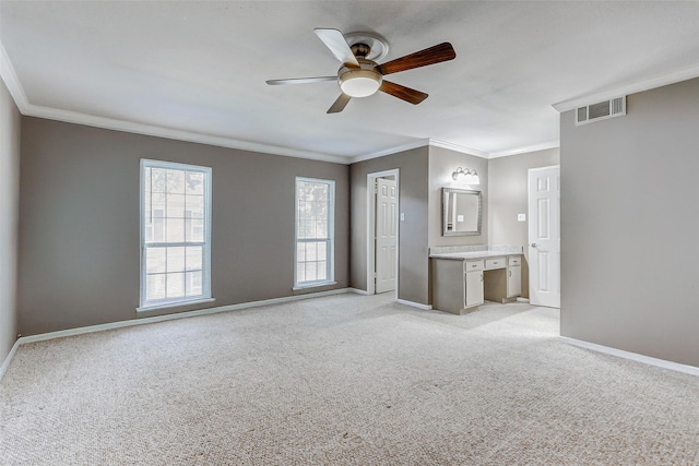 13060 Trail Hollow Dr Unit 3060, Houston, TX 77079 - unfurnished bedroom with crown molding, light colored carpet, baseboards, ensuite bath, and ceiling fan