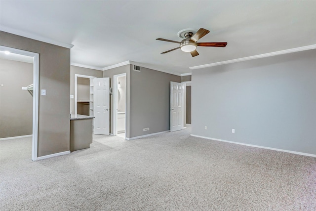 13060 Trail Hollow Dr Unit 3060, Houston, TX 77079 - unfurnished bedroom with a walk in closet, ornamental molding, baseboards, light carpet, and a closet
