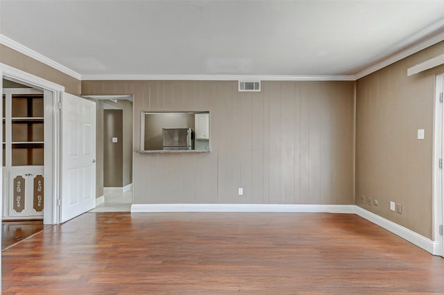 13060 Trail Hollow Dr Unit 3060, Houston, TX 77079 - spare room featuring wood finished floors, crown molding, and baseboards