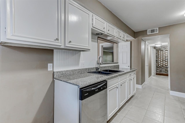 13060 Trail Hollow Dr Unit 3060, Houston, TX 77079 - kitchen with stainless steel dishwasher, a sink, white cabinetry, baseboards, and light stone countertops