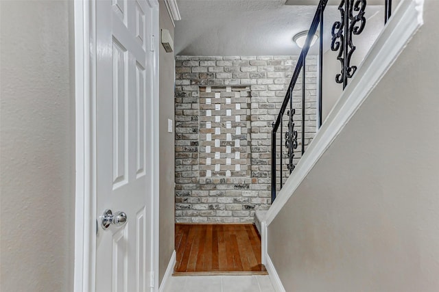 13060 Trail Hollow Dr Unit 3060, Houston, TX 77079 - stairs featuring a textured ceiling and baseboards