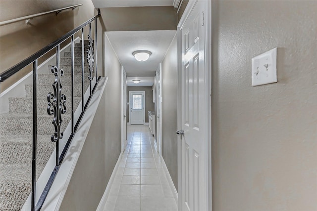 13060 Trail Hollow Dr Unit 3060, Houston, TX 77079 - hallway with light tile patterned floors and baseboards