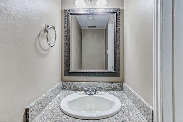 13060 Trail Hollow Dr Unit 3060, Houston, TX 77079 - bathroom with vanity and a textured wall