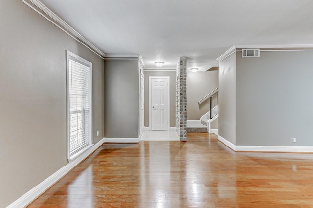 13060 Trail Hollow Dr Unit 3060, Houston, TX 77079 - empty room featuring light wood-type flooring, stairway, crown molding, and baseboards