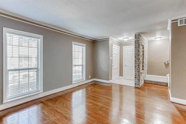13060 Trail Hollow Dr Unit 3060, Houston, TX 77079 - spare room featuring light wood-style floors, baseboards, and crown molding