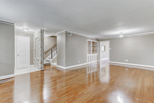 13060 Trail Hollow Dr Unit 3060, Houston, TX 77079 - unfurnished room featuring ornamental molding, stairs, wood-type flooring, and baseboards
