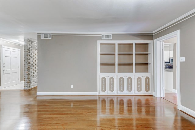 13060 Trail Hollow Dr Unit 3060, Houston, TX 77079 - unfurnished room with crown molding, wood finished floors, and baseboards
