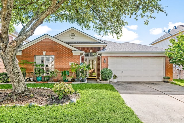 traditional home featuring brick siding, an attached garage, a shingled roof, driveway, and a front yard