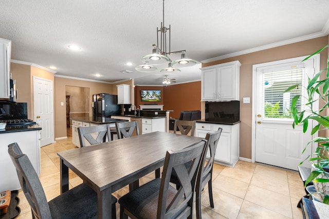 dining space featuring light tile patterned floors, recessed lighting, crown molding, and baseboards