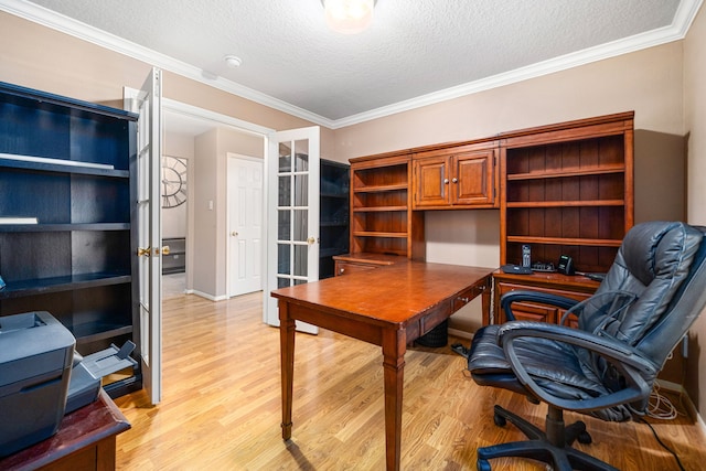office area with light wood-style floors, a textured ceiling, ornamental molding, and french doors