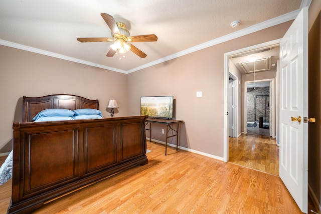 bedroom with attic access, light wood-style flooring, baseboards, ornamental molding, and ceiling fan