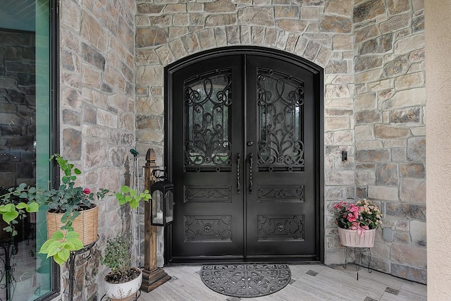 280 Sundog Rd, Huntsville, TX 77340 - property entrance with french doors and stone siding