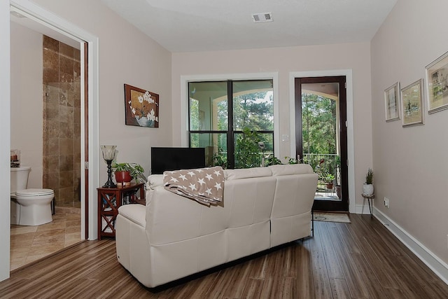 280 Sundog Rd, Huntsville, TX 77340 - living room with dark wood-style flooring and baseboards