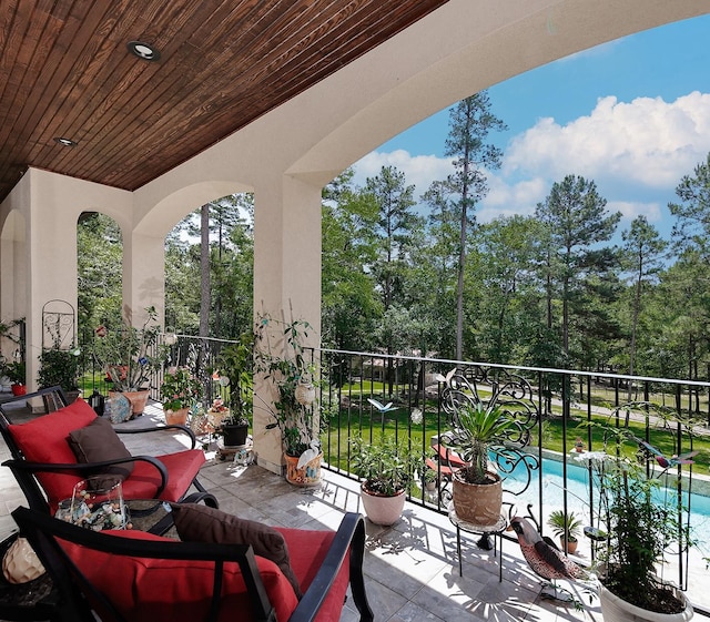 280 Sundog Rd, Huntsville, TX 77340 - balcony featuring view of pool and view of wooded area