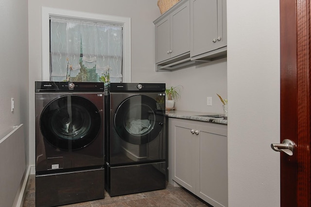 280 Sundog Rd, Huntsville, TX 77340 - laundry area featuring washing machine and dryer and cabinet space