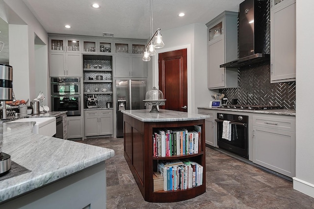 280 Sundog Rd, Huntsville, TX 77340 - kitchen with open shelves, wall chimney exhaust hood, stainless steel appliances, gray cabinetry, and backsplash