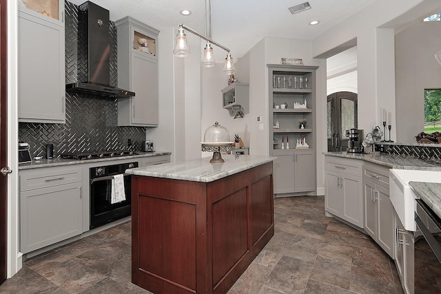 280 Sundog Rd, Huntsville, TX 77340 - kitchen with black appliances, wall chimney exhaust hood, decorative backsplash, stone finish floors, and light stone counters