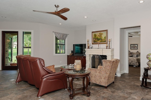280 Sundog Rd, Huntsville, TX 77340 - living area with stone finish flooring, a fireplace, baseboards, ceiling fan, and recessed lighting