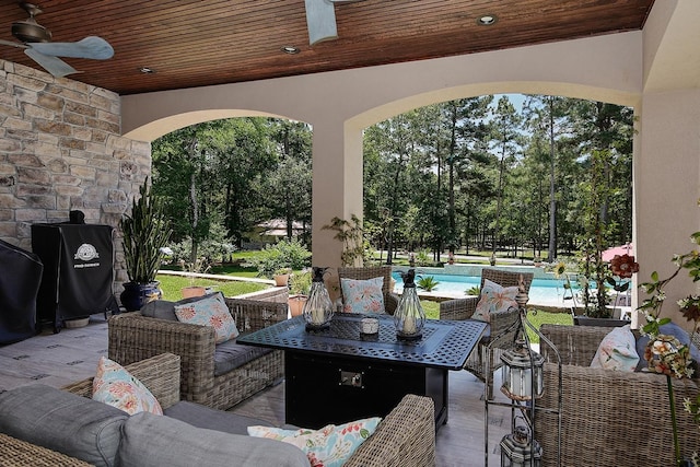 280 Sundog Rd, Huntsville, TX 77340 - view of patio / terrace featuring outdoor lounge area, a ceiling fan, an outdoor pool, and view of wooded area