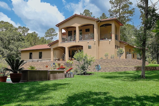 280 Sundog Rd, Huntsville, TX 77340 - rear view of property with a balcony, stucco siding, and a yard