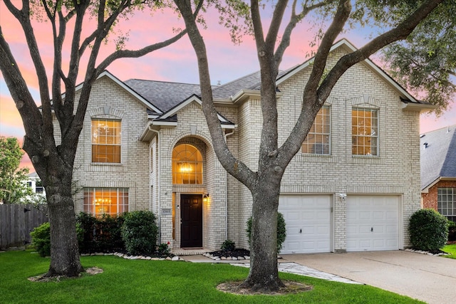 17815 Fairgrove Park Dr, Houston, TX 77095 - view of front of house with brick siding, driveway, an attached garage, and roof with shingles