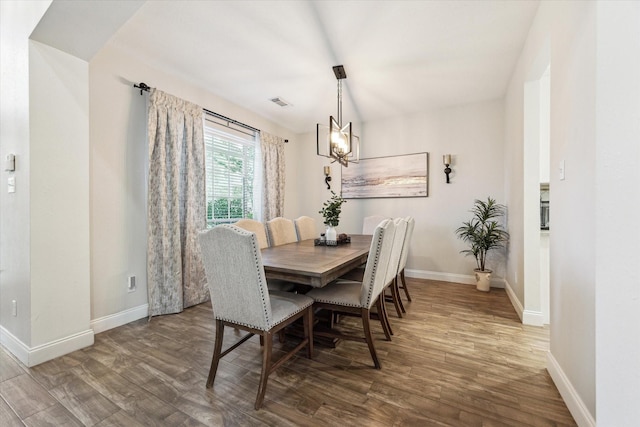 17815 Fairgrove Park Dr, Houston, TX 77095 - dining area featuring wood finished floors, baseboards, and a chandelier