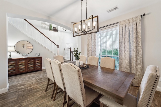 17815 Fairgrove Park Dr, Houston, TX 77095 - dining area with a chandelier, baseboards, wood finished floors, and stairs