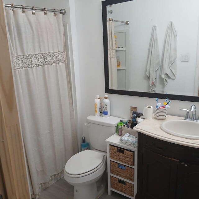 16514 Green Manor Dr, Humble, TX 77396 - bathroom featuring vanity, toilet, and a shower with shower curtain