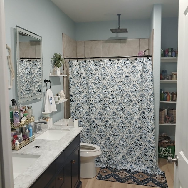 16514 Green Manor Dr, Humble, TX 77396 - bathroom with toilet, a shower with shower curtain, double vanity, and wood finished floors