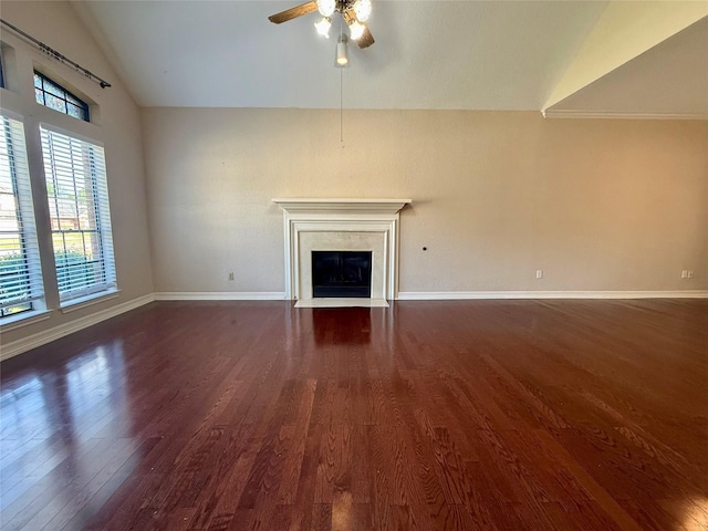 110 Beechwood, Lake Jackson, TX 77566 - unfurnished living room with lofted ceiling, dark wood-style floors, a ceiling fan, a fireplace with flush hearth, and baseboards