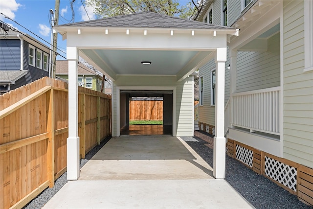 309 E 16th St, Houston, TX 77008 - doorway to property featuring a shingled roof and fence