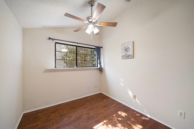 9537 Pagewood Ln Unit 9537, Houston, TX 77063 - spare room featuring lofted ceiling, wood finished floors, ceiling fan, baseboards, and a textured ceiling