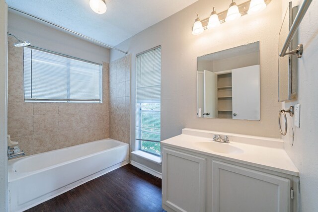 1502 Stevenage Ln, Channelview, TX 77530 - full bathroom with wood finished floors, vanity, and tub / shower combination