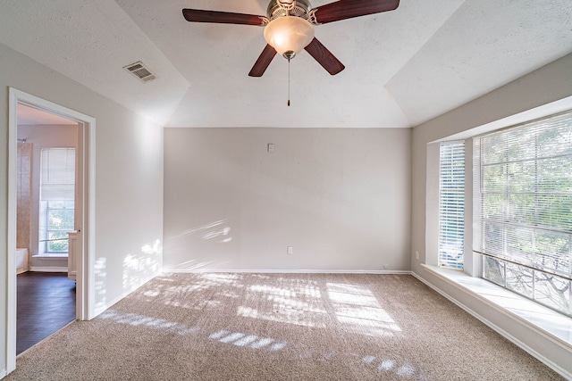 1502 Stevenage Ln, Channelview, TX 77530 - carpeted empty room with lofted ceiling, baseboards, ceiling fan, and a textured ceiling